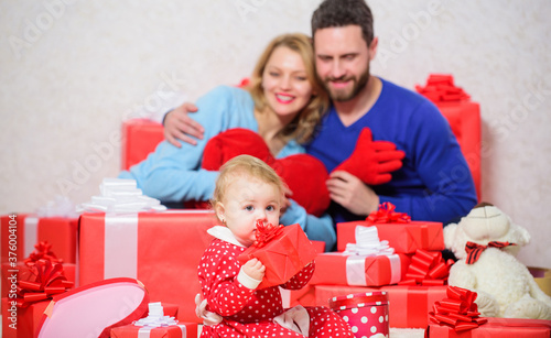 father, mother and doughter child. Shopping online. Boxing day. Happy family with present box. Valentines day. Red boxes. Love and trust in family. Look around, and you will find your love