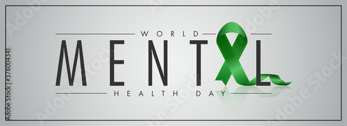 World Mental Health Day Text with Green Ribbon Cross on Grey Background. Header or Banner Design.