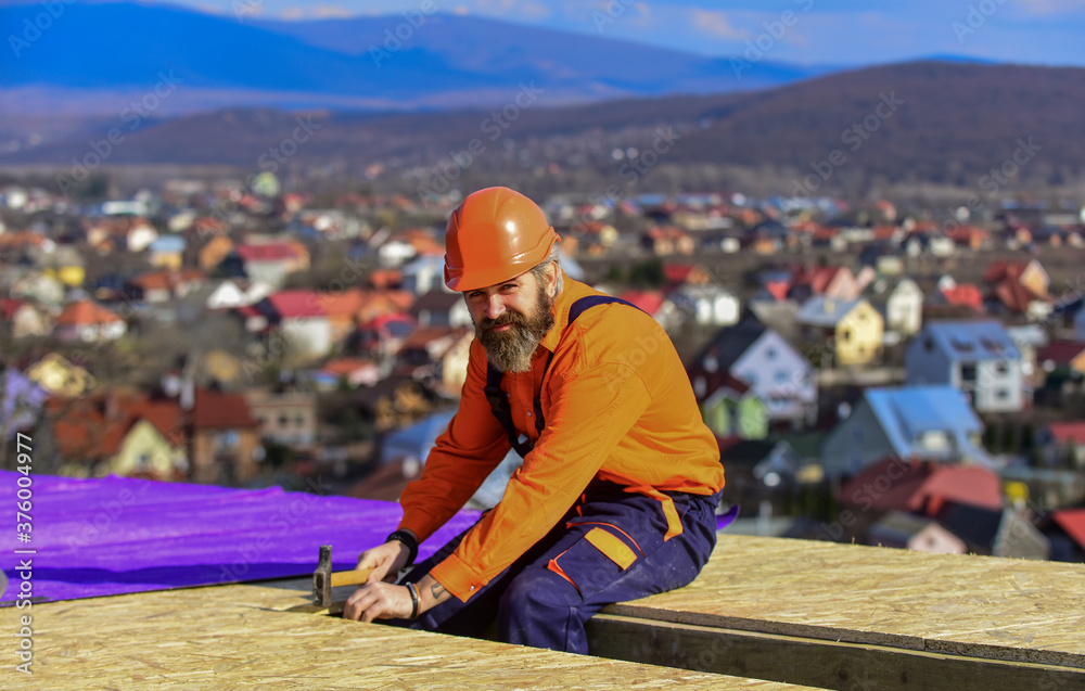 High altitude works. Heat insulation. Builder roofing surface. Professional master repair roof. Flat roof installation. Roofer constructing new roof. Construction building. Waterproof sheet materials High altitude works. Heat insulation. Builder roofing surface. Professional master repair roof. Flat roof installation. Roofer constructing new roof. Construction building. Waterproof sheet materials