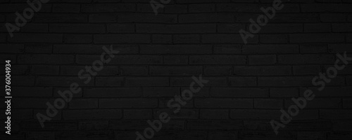 Abstract Black Brick Wall Texture Background. Weathered Brickwork Design Backdrop. Wide Panorama Picture.