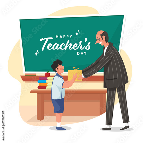 Happy Teacher's Day Text on Green Chalkboard with Student Boy Giving Gift to His Class Teacher.
