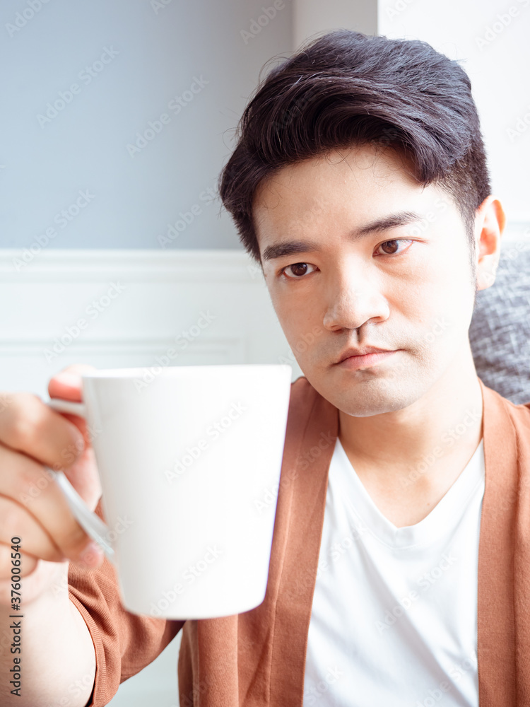 handsome young man drinking at home handsome young man drinking at home