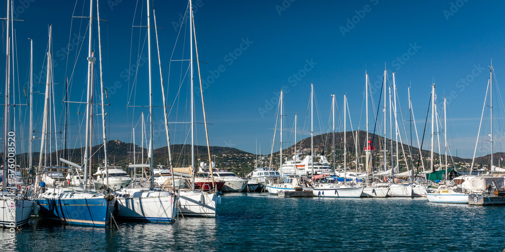 sailboats moored in the Saint Tropez marina on a sunny day