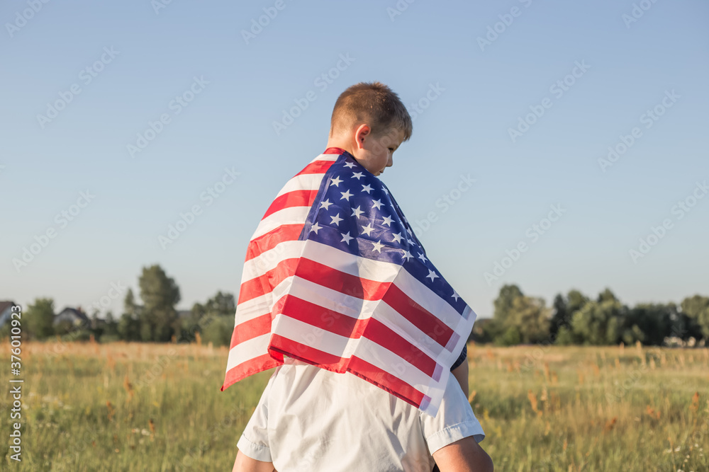 Naklejka premium Attractive old senior man and grahdson holding USA Flag. National holiday. Grandpa retiree. Retirement parent