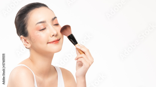 Beauty asian woman hold make up brush and cheerful with make up brush