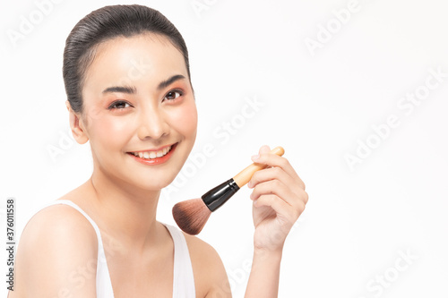 Beauty asian woman hold make up brush and cheerful with make up brush