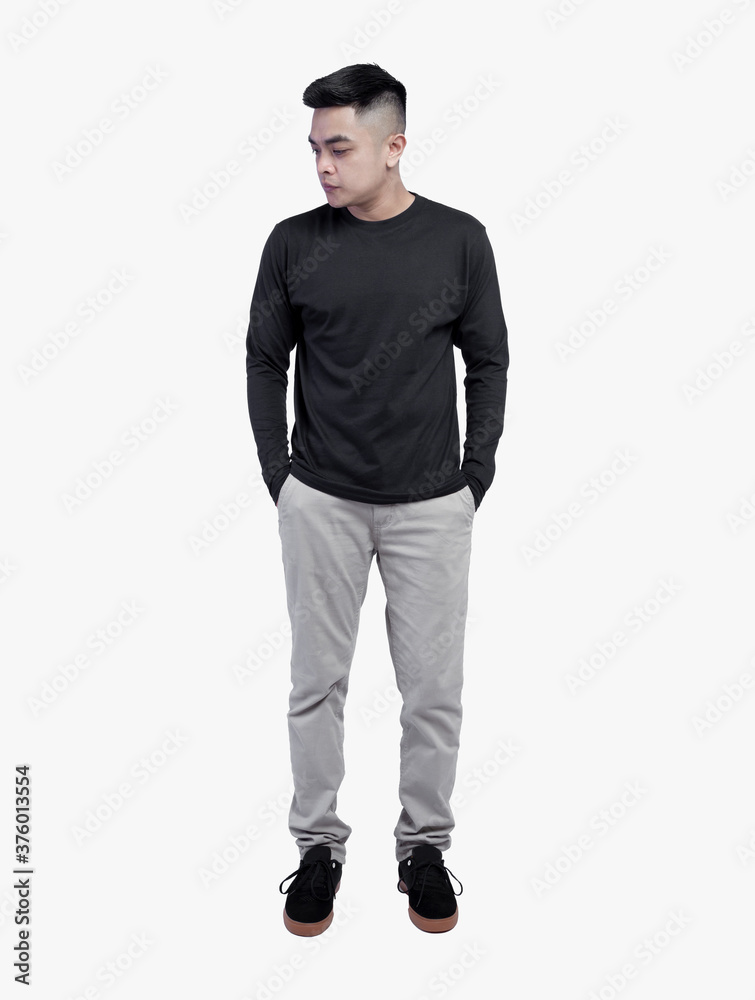 Young handsome man wearing black long sleeve t shirt posing on white background Young handsome man wearing black long sleeve t shirt posing on white background
