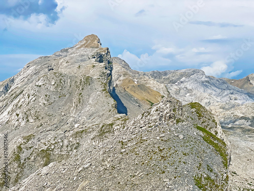 Alpine peak Huetstock Barglen Schiben above the Melchtal valley (or Melch valley) and in the Uri Alps mountain massif, Melchtal - Canton of Obwald, Switzerland (Kanton Obwalden, Schweiz) photo