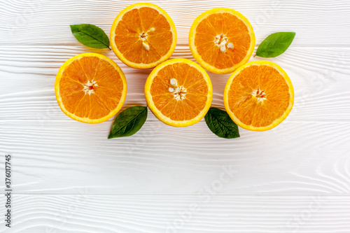 Orange slices on the on white table wooden background top view flat lay copy space