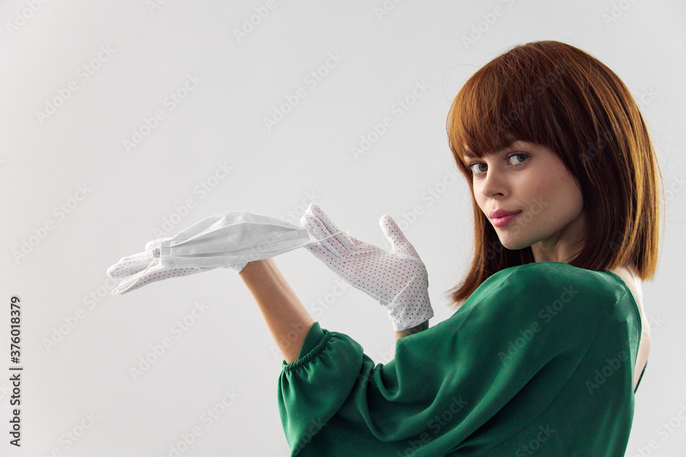Woman in fashion dress posing in medical mask virus covid-19 Woman in fashion dress posing in medical mask virus covid-19
