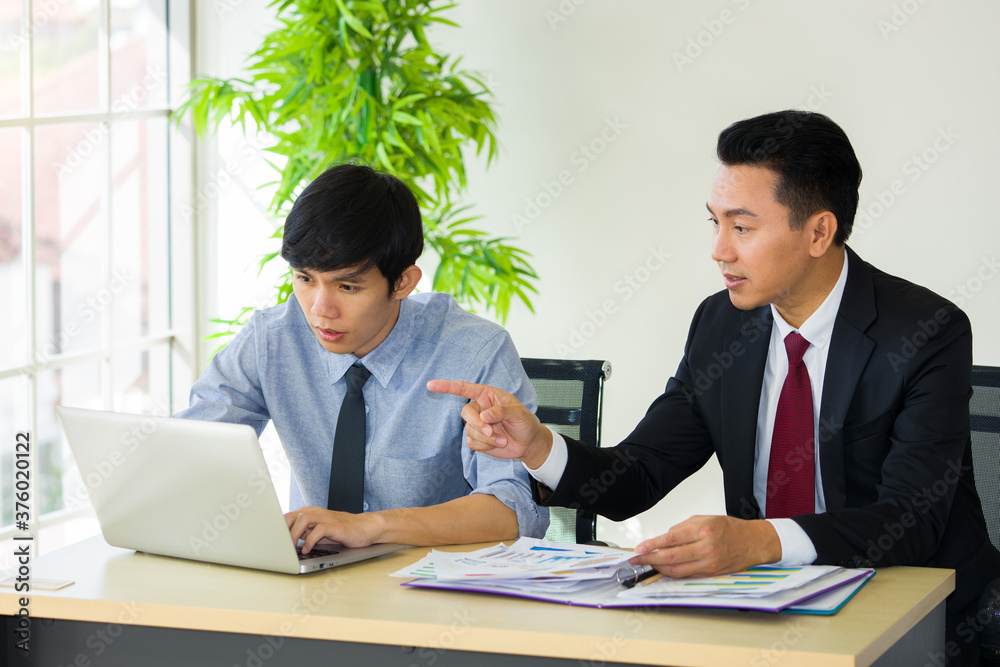 The supervisor is teaching the new employee. The supervisor is teaching the new employee.