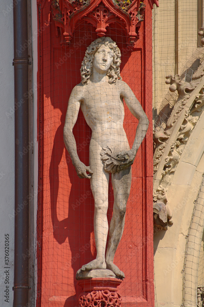 Scupture of Adam at the main portal of Mary's chapel in Würzburg, Germany Scupture of Adam at the main portal of Mary's chapel in Würzburg, Germany