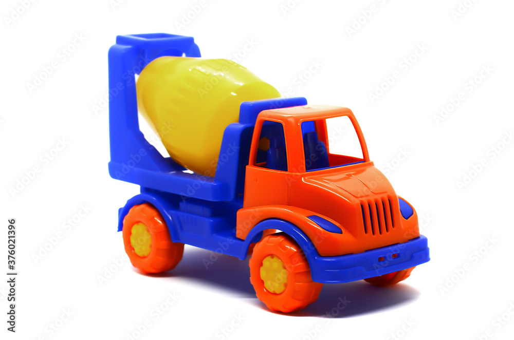 Naklejka premium Children's plastic multi-colored toy concrete mixer on a white background. Toy vehicles, outdoor games for children.
