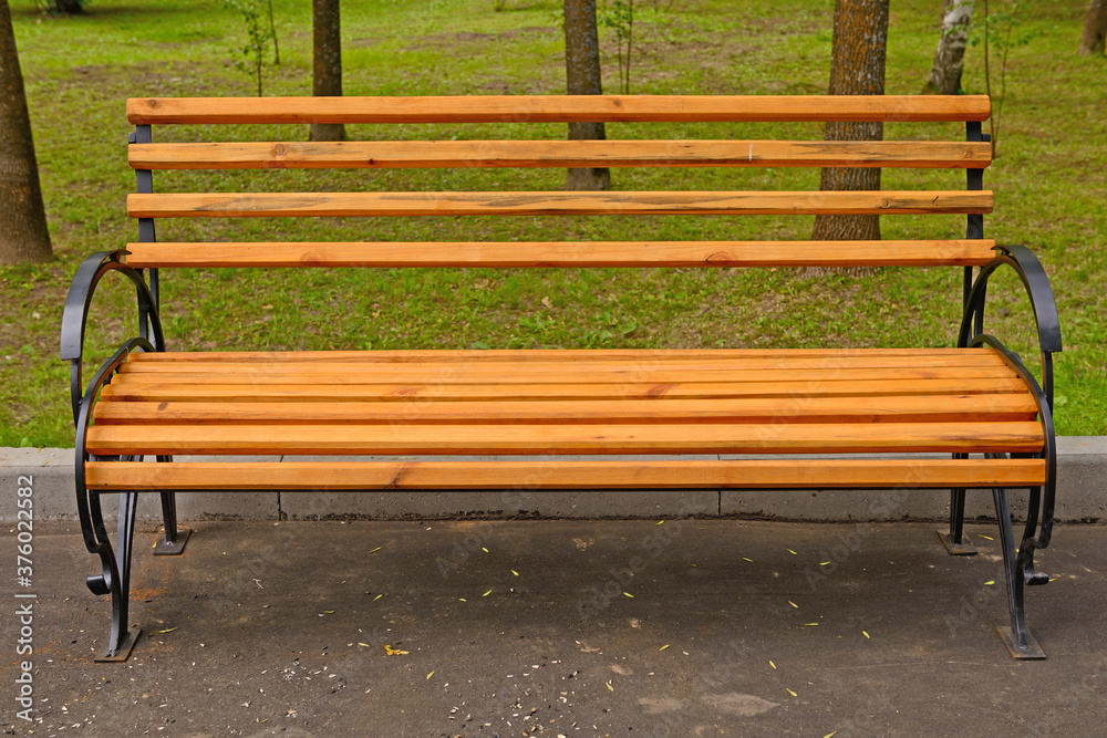 Bench with metal frame and wooden boards in the Park Bench with metal frame and wooden boards in the Park