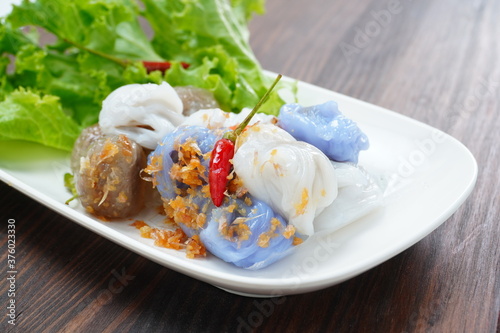 Thai steamed rice skin dumplings with vegetables and fresh chili photo