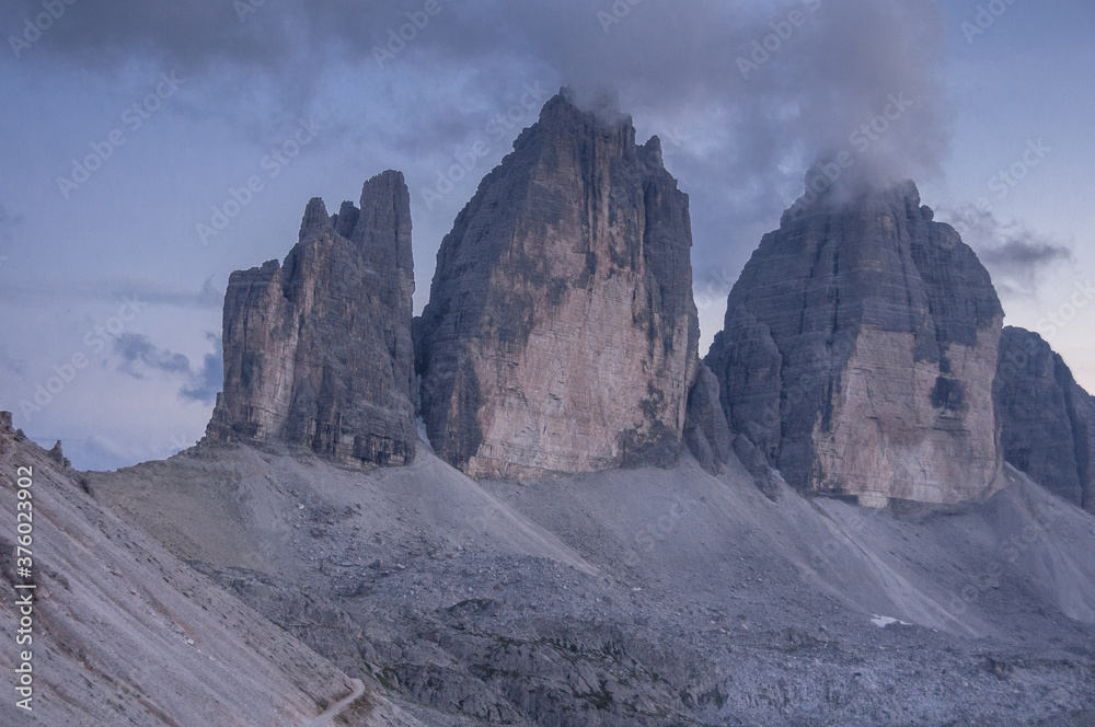 View of Tre Cime di Lavaredo, Cima Picolla, Cima Grande & Cima Oves summits at twilight as seen from Rfiugio Locatelli, Sesto Dolomites, Auronzo di Cadore, Alto-Adige, Bolzano, South Tirol, Italy.