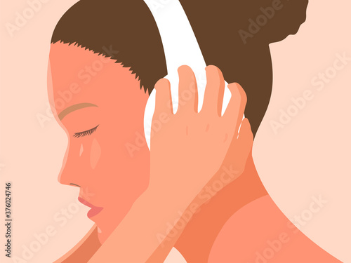 a woman listening deeply to music