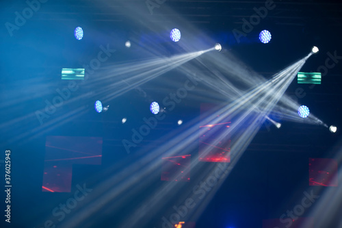 Stage spotlights background light.Concert lighting on a dark background.