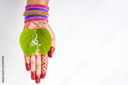 Indian festival Dussehra, green apta leaf in hand