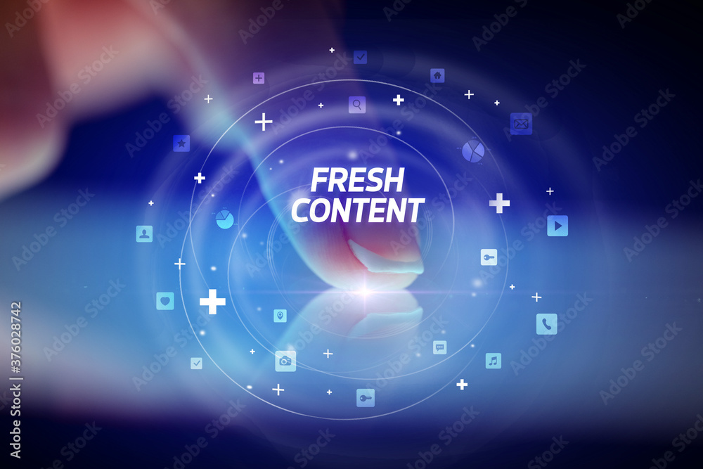 Finger touching tablet with social media icons and FRESH CONTENT Finger touching tablet with social media icons and FRESH CONTENT