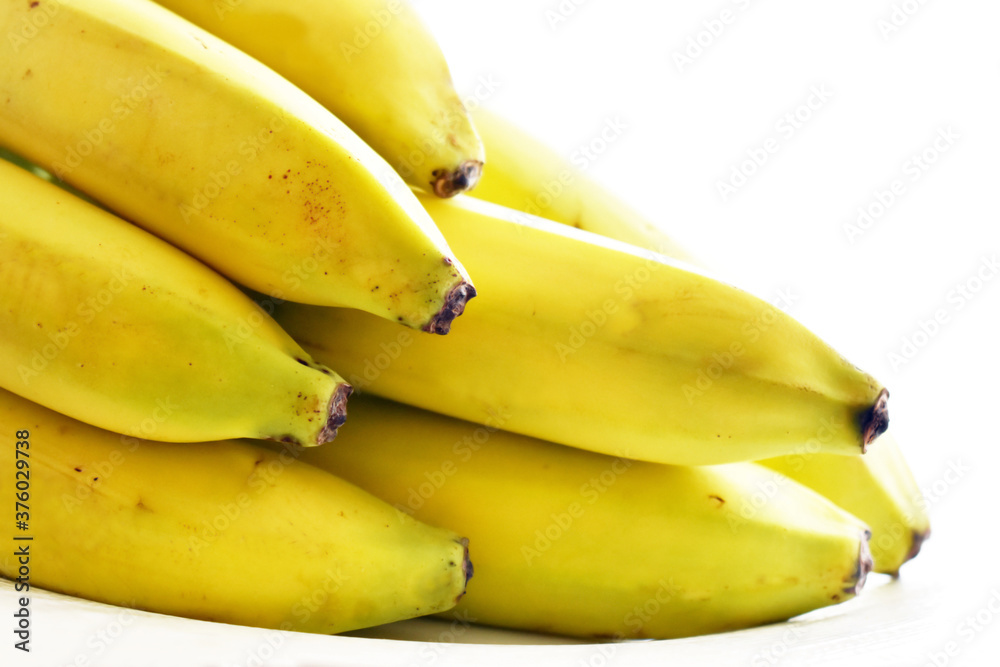 Ripe bananas on white background