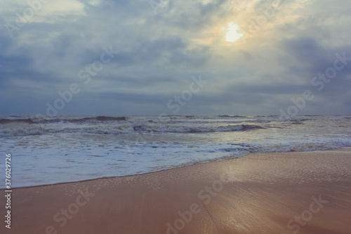 Fototapeta Naklejka Na Ścianę i Meble -  A beautiful/best scenic sunset and sea waves in the evening