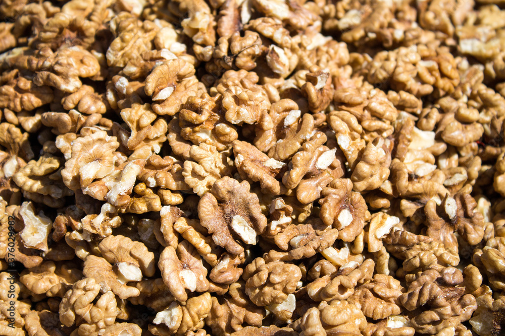 Walnuts are scattered on the table. Background for design Walnuts are scattered on the table. Background for design