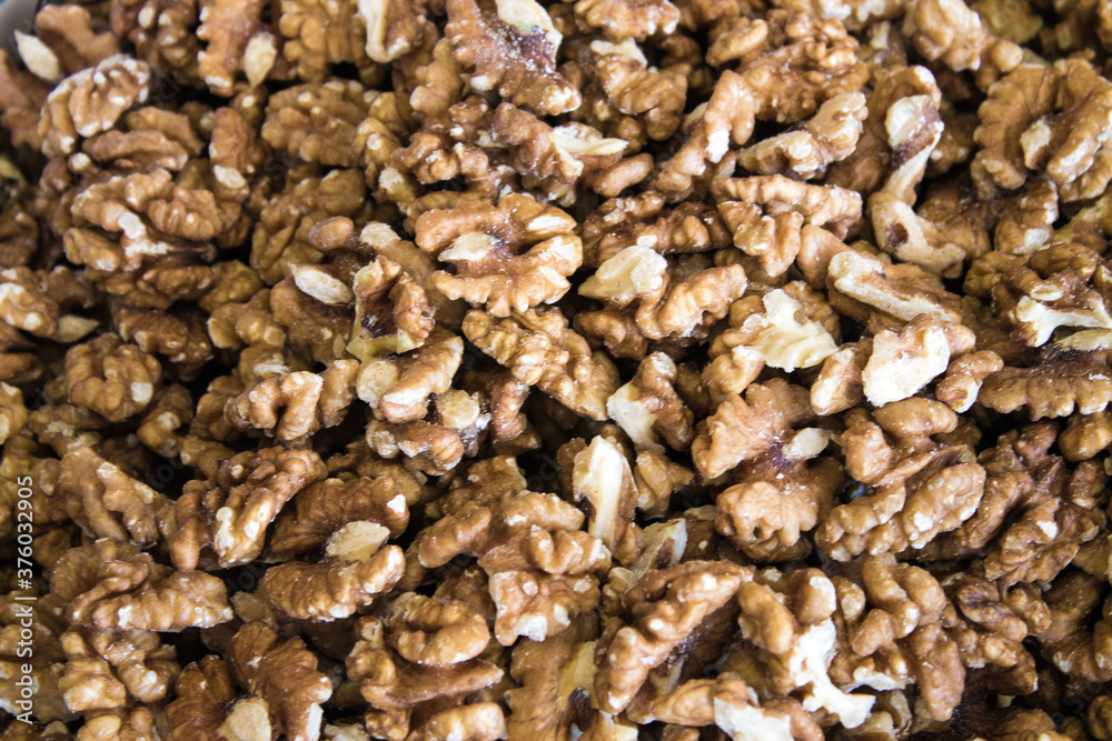 Walnuts are scattered on the table. Background for design Walnuts are scattered on the table. Background for design