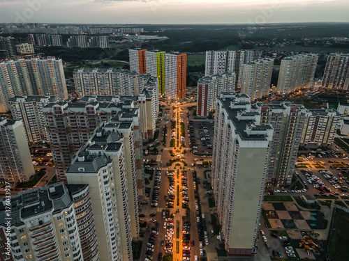 City street and high skyscrapers in the evening