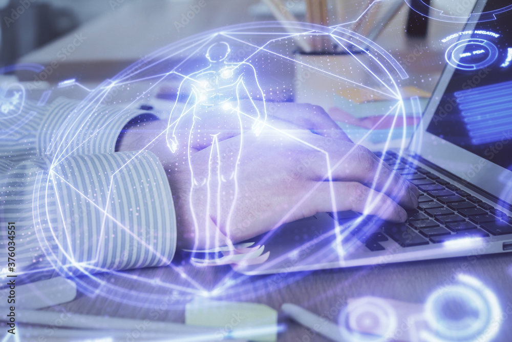 Science hologram with man working on computer on background. Concept of study. Double exposure. Science hologram with man working on computer on background. Concept of study. Double exposure.