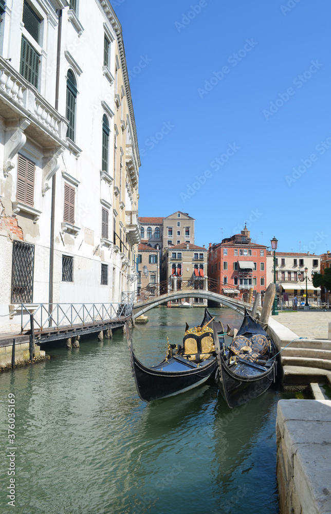 
glimpses of Venetian palaces with canals, bridges and typical gondolas