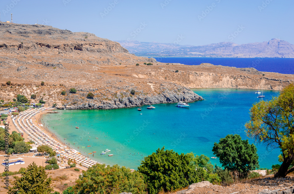 The beach and the gulf of Lindos. Crystal clear waters. Rhodes island, Greece.