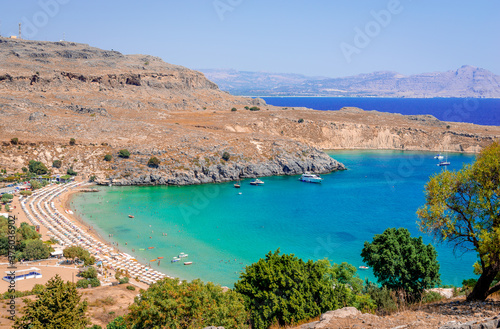Fototapeta Naklejka Na Ścianę i Meble -  The beach and the gulf of Lindos. Crystal clear waters. Rhodes island, Greece.