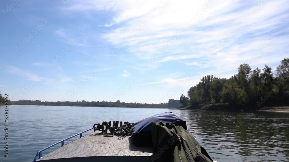 Front deck of a fishing boat sailing on a river Front deck of a fishing boat sailing on a river