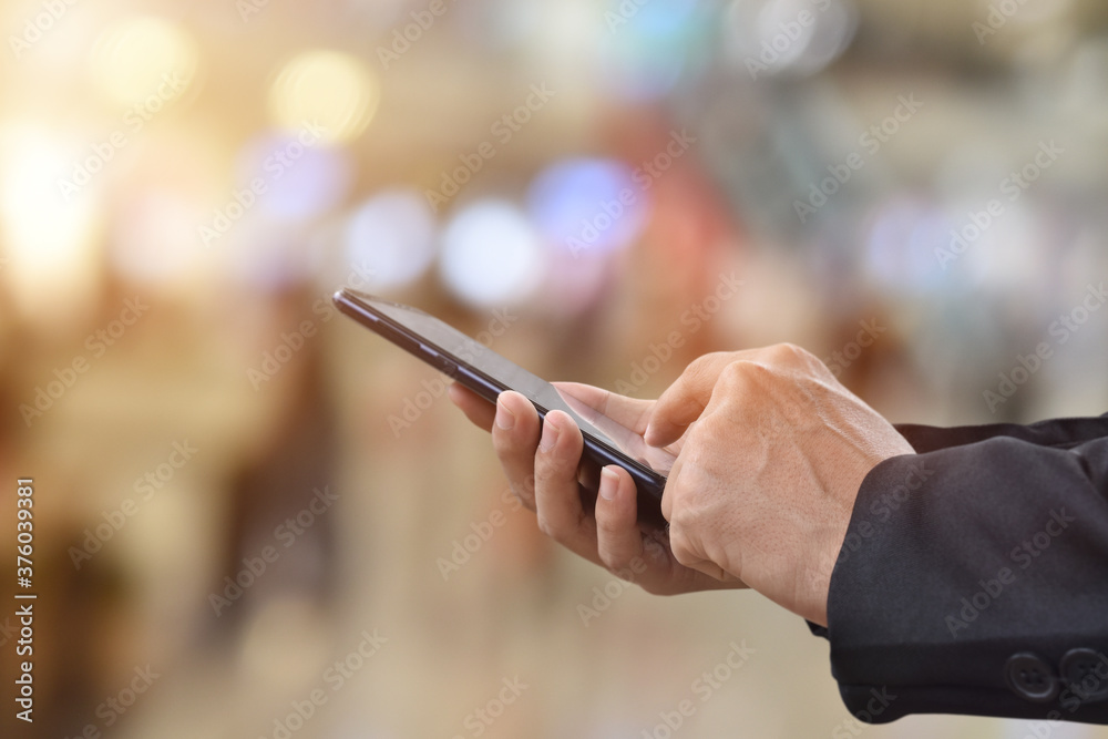 Close-up image of male hands using mobile smartphone. Business technology and social networks concept Close-up image of male hands using mobile smartphone. Business technology and social networks concept