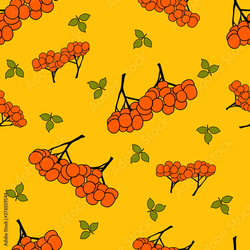 Seamless vector illustration with bunches of rowan on a yellow background. Suitable for textile, poster, printing