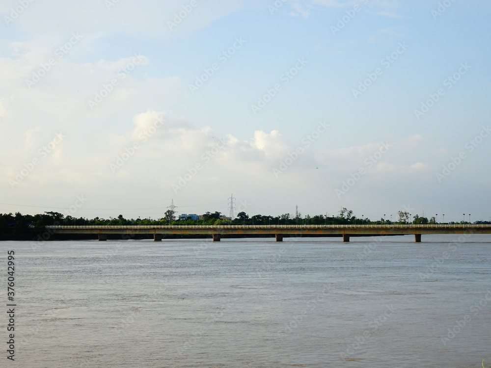 Old bridge standing on river filled with water in Bhubaneswar