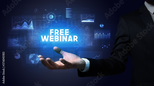 Wallpaper Mural Hand of Businessman holding FREE WEBINAR inscription, business success concept Torontodigital.ca