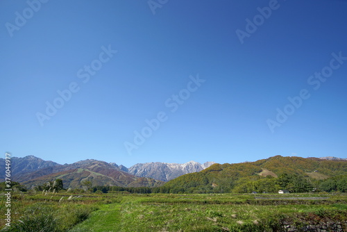 sunny autumn panorama of countryside in Japan, Hakuba valley