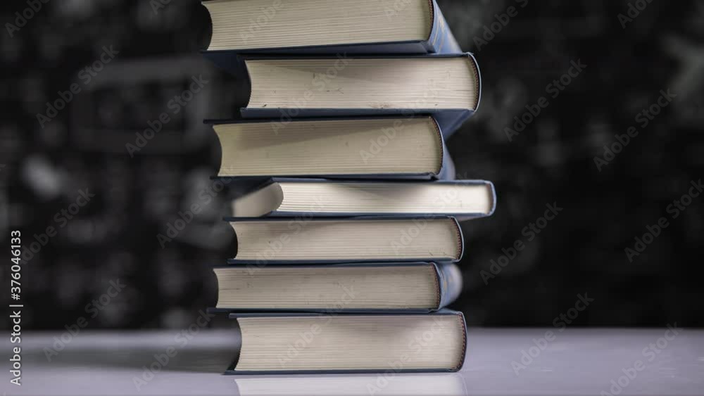 Stop motion of stack pile of books