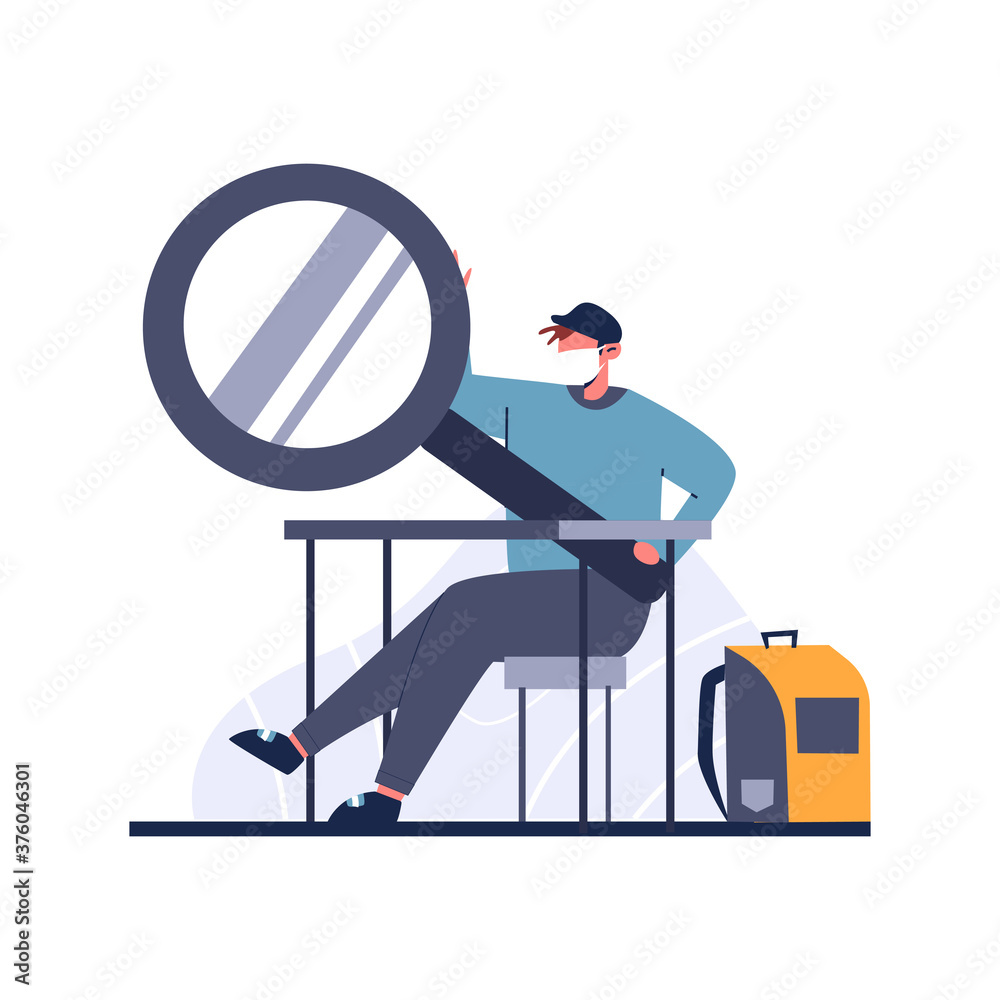 Back to school, male student with a huge magnifying glass and a ...