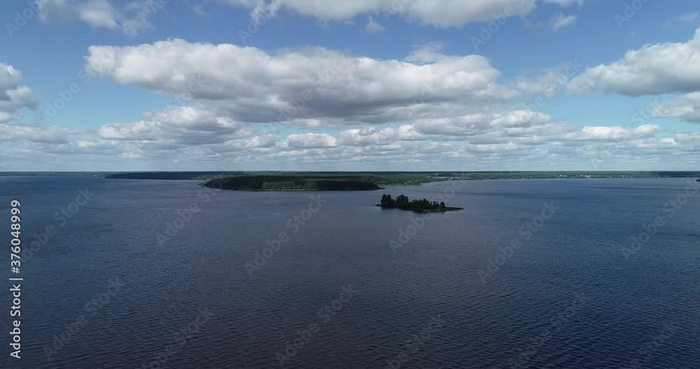 Flight over an island with an abandoned bell tower on the Volga River and cruise ships. Drone view for an abandoned chapel on the island. Travel along the golden ring of Russia. Cruise along the Volga Flight over an island with an abandoned bell tower on the Volga River and cruise ships. Drone view for an abandoned chapel on the island. Travel along the golden ring of Russia. Cruise along the Volga