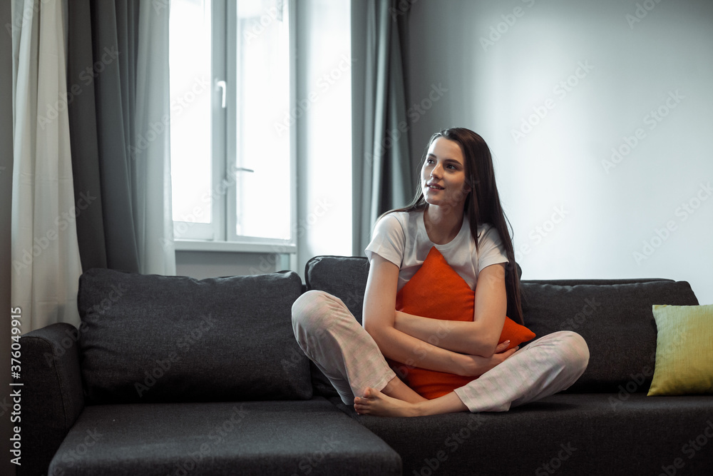 Young woman pretty relaxing on couch in living room Young woman pretty relaxing on couch in living room