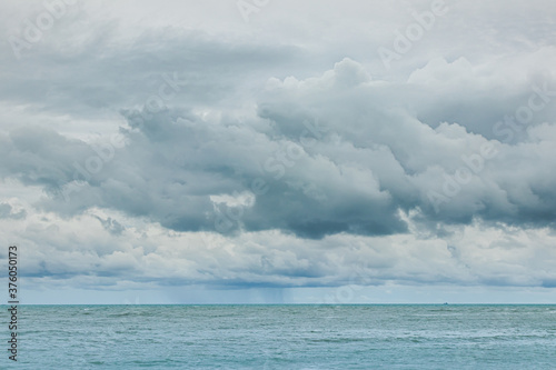 Rain clouds floating in the sky at sea