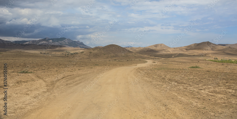 Dirt road in mountainous terrain Dirt road in mountainous terrain