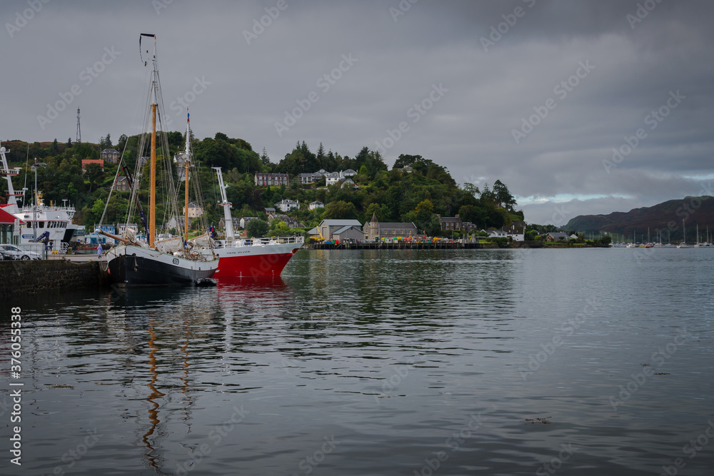 Boats in Oban harbor on a cloudy day, Scotland