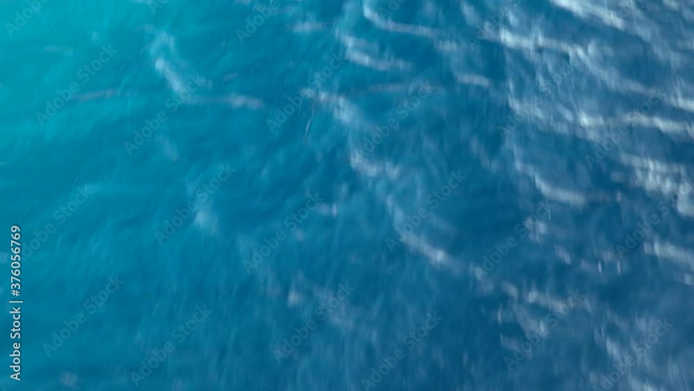 Flying over the surface of the blue sea. Flying over the surface of the blue sea.