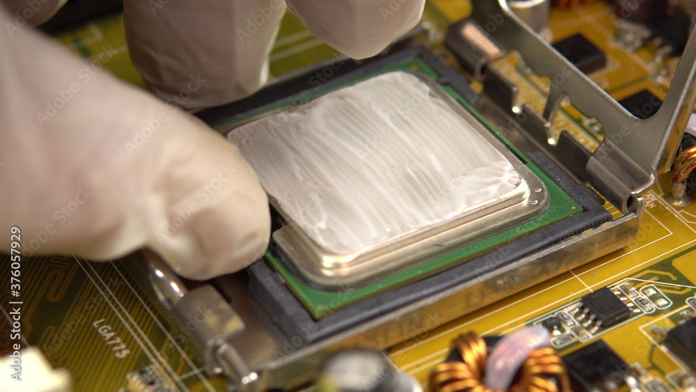 Pulls the central processor out of the motherboard. The processing system of the central processes of the PC. Many different chips. View of the computer parsed. Pulls the central processor out of the motherboard. The processing system of the central processes of the PC. Many different chips. View of the computer parsed.