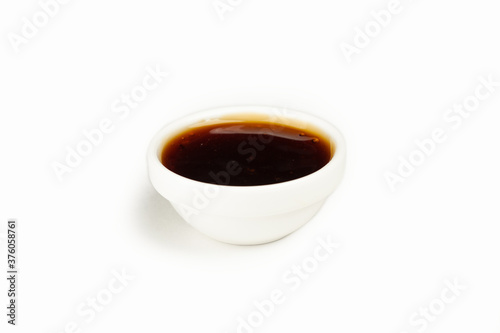 Unagi sauce in a bowl on a white background. For the restaurant menu. Traditional Japanese sushi seasoning. Healthy eating