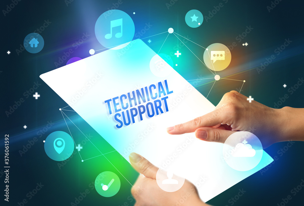 Holding futuristic tablet with TECHNICAL SUPPORT inscription, new technology concept Holding futuristic tablet with TECHNICAL SUPPORT inscription, new technology concept